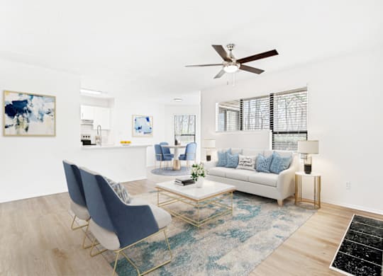 Living Room With Ceiling Fan at Bridges at Mallard Creek Apartment Homes, North Carolina
