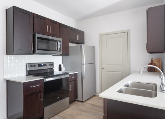 a kitchen with a sink and a stove