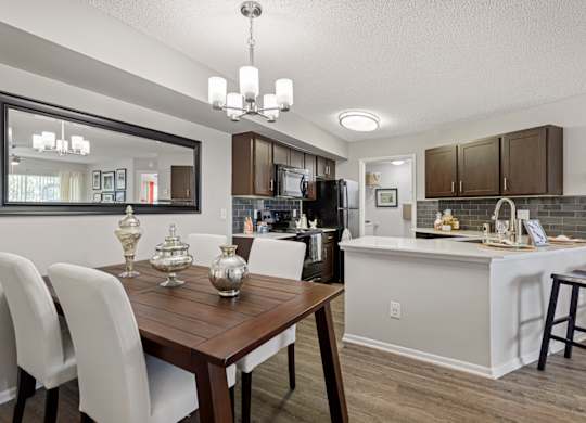 kitchen and dining room with hardwood-style flooring