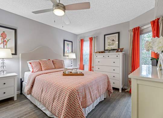 bedroom with hardwood-style flooring and ceiling fan