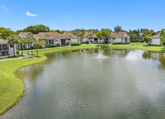 apartment community with a lake in the center