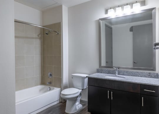 a bathroom with a sink toilet and a bath tub