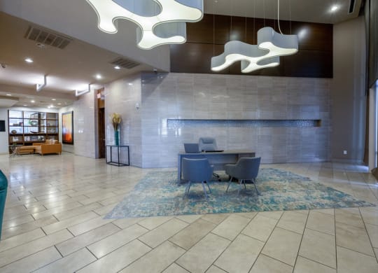 a conference room with a table and chairs in a lobby