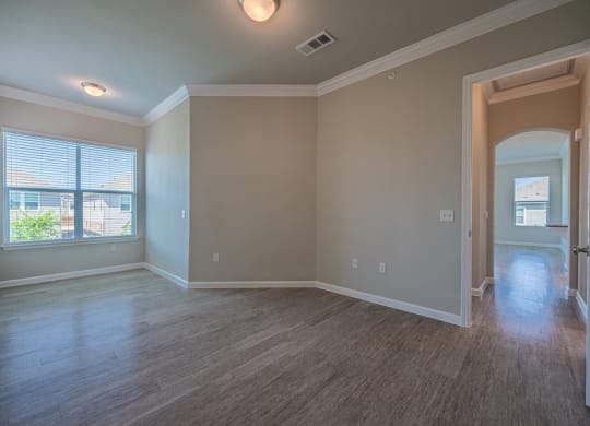 Bedroom area with a nook and hardwood flooring