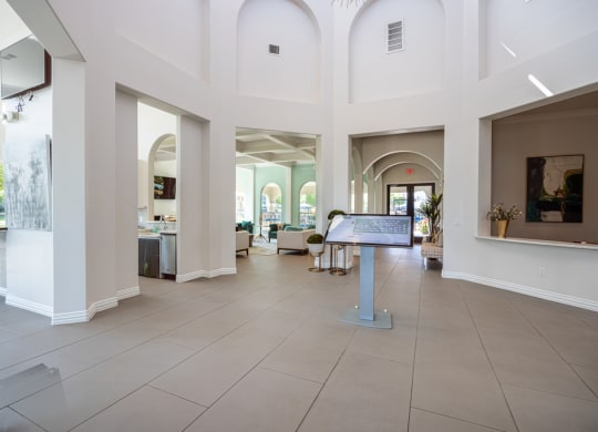 Leasing office lobby with tall walls and a greeting area
