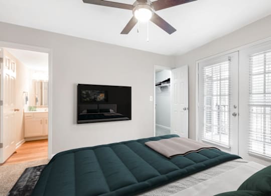 Bedroom With TV at Caveness Farms Apartments, Wake Forest, 27587 