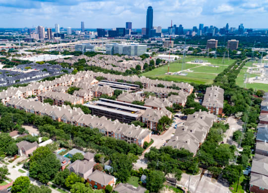 aerial view of the apartment community and surrounding city