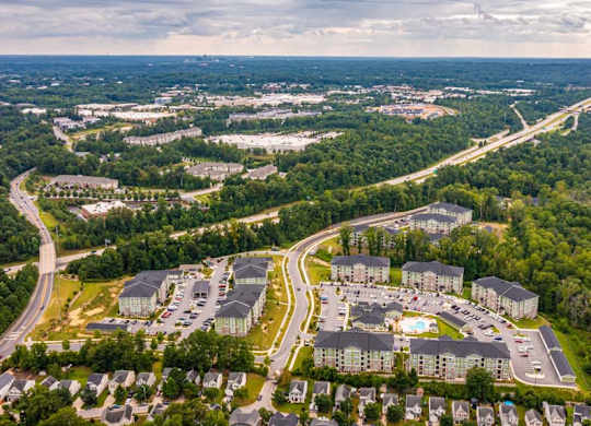 An aerial view of a large housing complex surrounded by trees. at Foxwood Apartments, Raleigh-Durham, North Carolina
