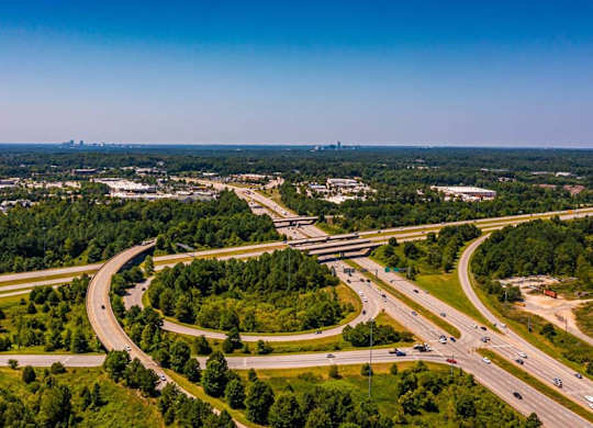 A highway interchange with multiple lanes and traffic at Foxwood Apartments, Raleigh-Durham, NC