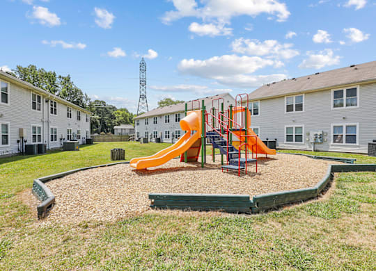 a playground at the enclave at woodbridge apartments in sugar land, tx