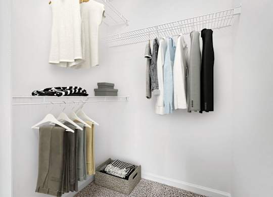 Closet With Clothes at The Grayson Apartment Homes, North Carolina