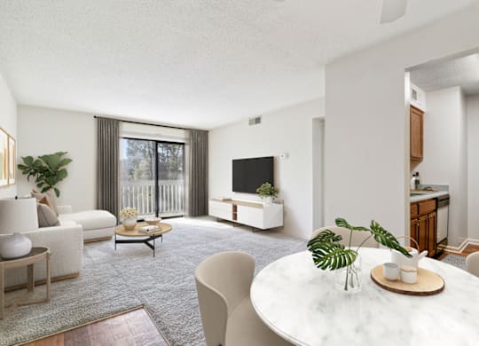 a living room with a white table and chairs and a large sliding glass door leading at Eastchester Ridge Apartments, High Point, NC, 27262