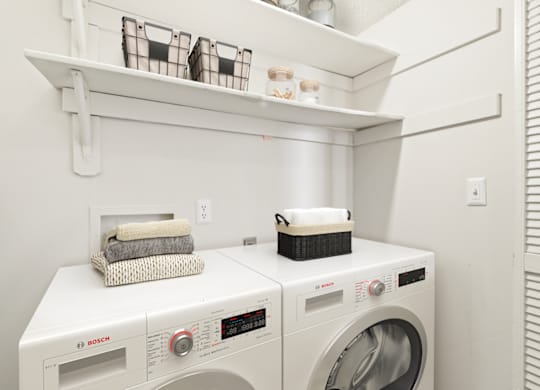 a laundry room with a washer and dryer at Eastchester Ridge Apartments, North Carolina, 27262
