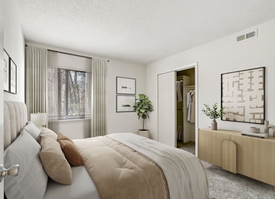 a bedroom with a large bed and a dresser with a mirror at Eastchester Ridge Apartments, High Point, North Carolina