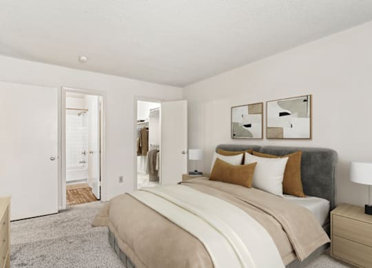 a bedroom with a large bed and white walls at Eastchester Ridge Apartments, High Point, North Carolina