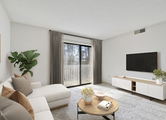 a living room with a white couch and a tv on the wall at Eastchester Ridge Apartments, High Point, NC, 27262
