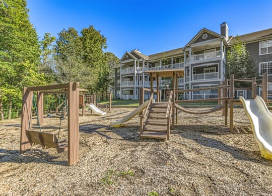 a playground at the enclave at woodbridge apartments in sugar land, tx