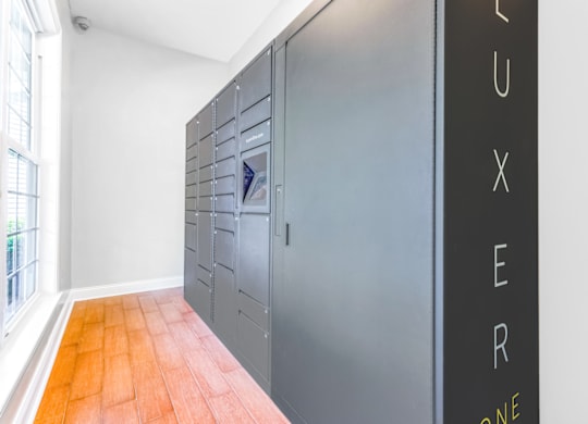 a row of lockers in a room with a large window