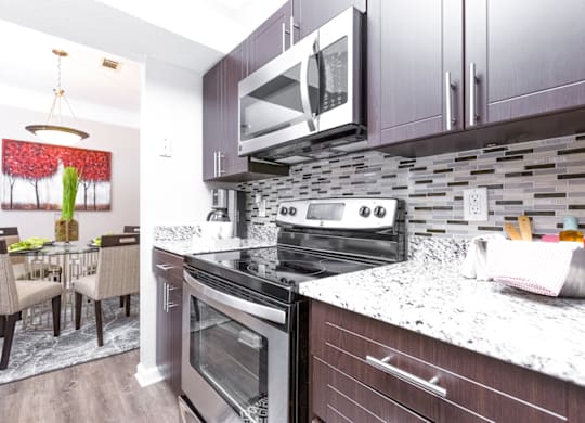 a kitchen and dining area in a 555 waverly unit