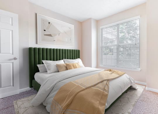 a bedroom with a bed and two windows