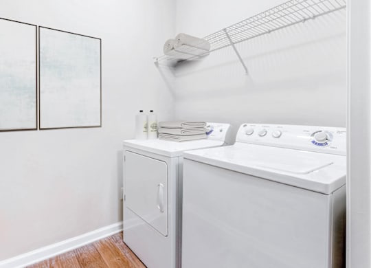 a laundry room with a washer and dryer