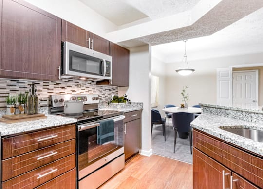 a kitchen and dining area in a 555 waverly unit