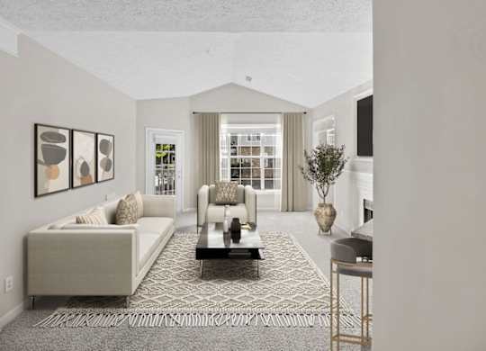 A living room with a white couch and a coffee table.