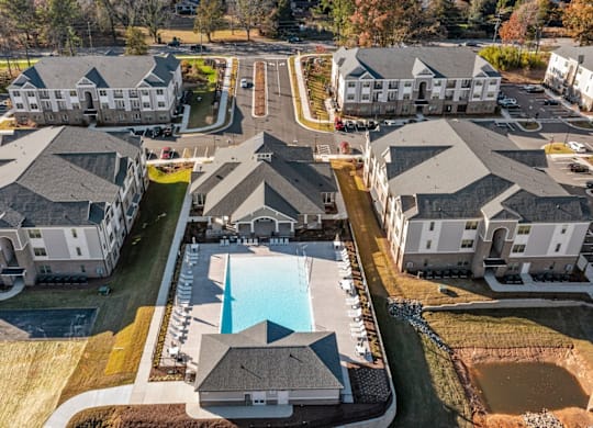 A bird's eye view of a residential complex with a swimming pool at Litchford 315 Apartments, North Carolina, 27615