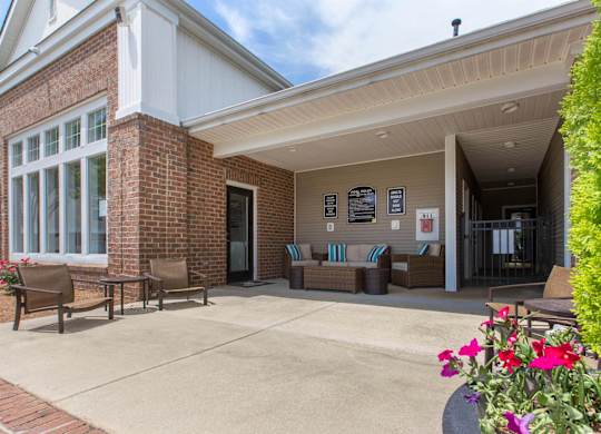 Clubhouse Exterior with Lounge with Patio Furniture at The Grayson Apartment Homes, North Carolina, 28262