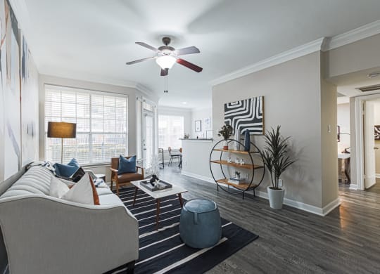 living room with hardwood-style flooring and ceiling fan