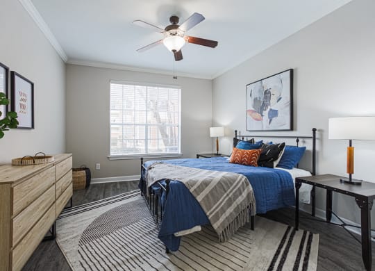 bedroom with hardwood-style flooring and ceiling fan