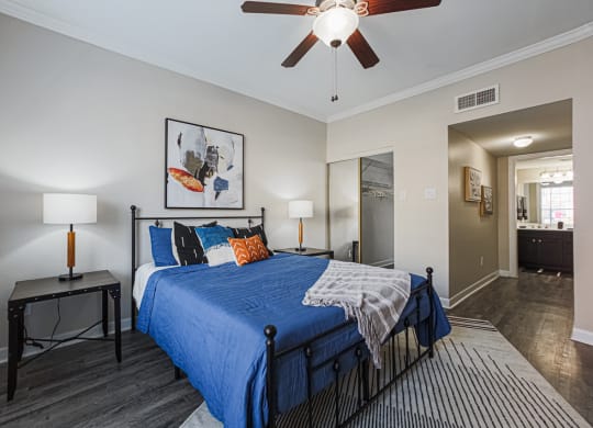 bedroom with hardwood-style flooring and ceiling fan
