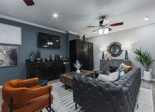 clubhouse with leather furniture and a tv