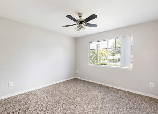bedroom with carpeted flooring and a ceiling fan