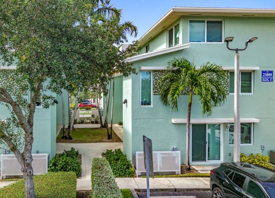 green paint exterior of apartment buildings