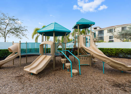A playground with a blue roof and a slide.