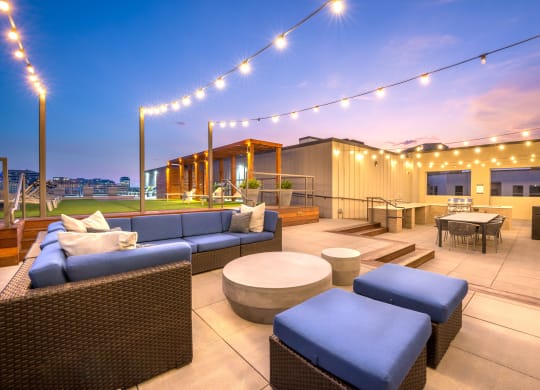 Outdoor grilling area facing extra guest seating and downtown Dallas