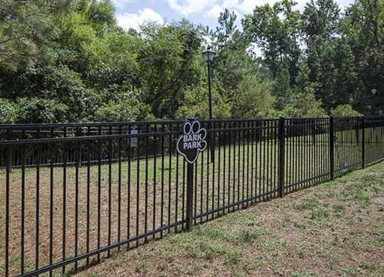 Fenced in Dog Park  with Trees in the Background