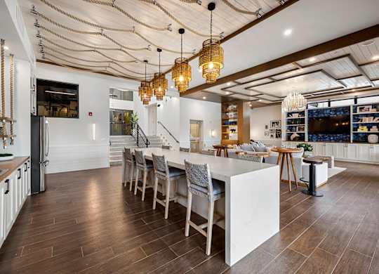 a kitchen with a large island and a dining table