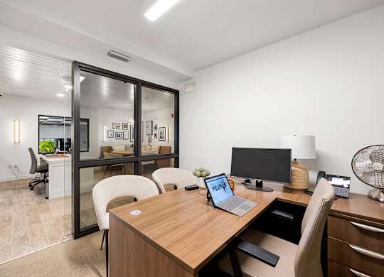 a home office with a desk and a computer