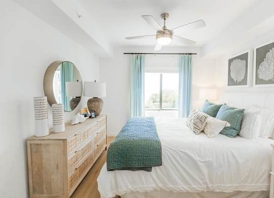 a bedroom with a bed and a dresser