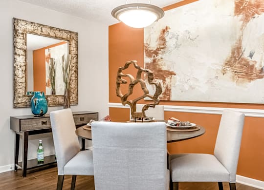 A dining room with a table and chairs at Paces Pointe Apartment Homes, Matthews, North Carolina