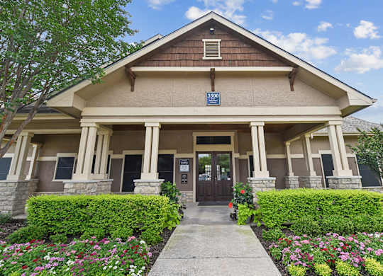A building with a brown roof and a sign that says