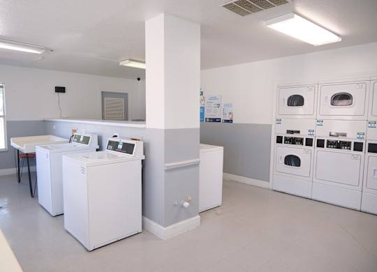 A laundromat with washers and dryers.
