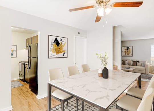 A dining room with a marble table and chairs at Regency Park Apartment Homes, North Carolina, 27616