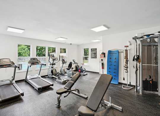 A gym with treadmills, weights, and exercise equipment at Regency Park Apartment Homes, North Carolina, 27616