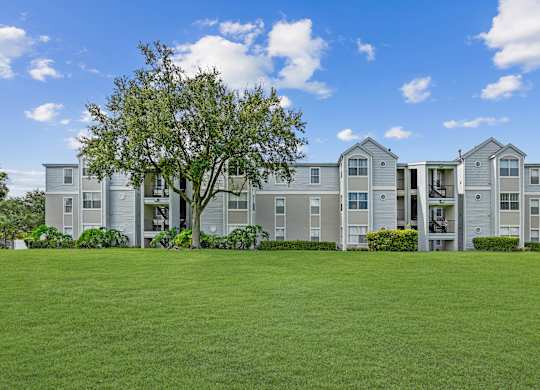 Exterior of apartment buildings with natural surround landscaping
