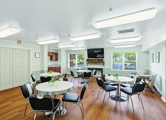 A white room with a table and chairs.