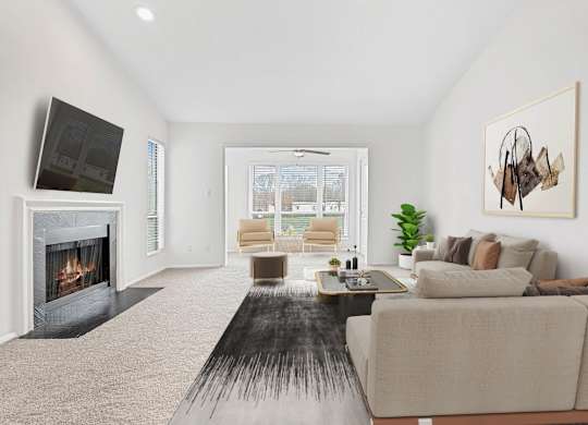 A modern living room with a fireplace and a large couch.