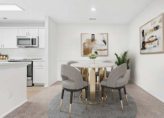 A modern dining room with a white table and grey chairs.